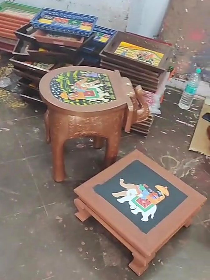 Finished hand painted chowkis drying in the workshop
