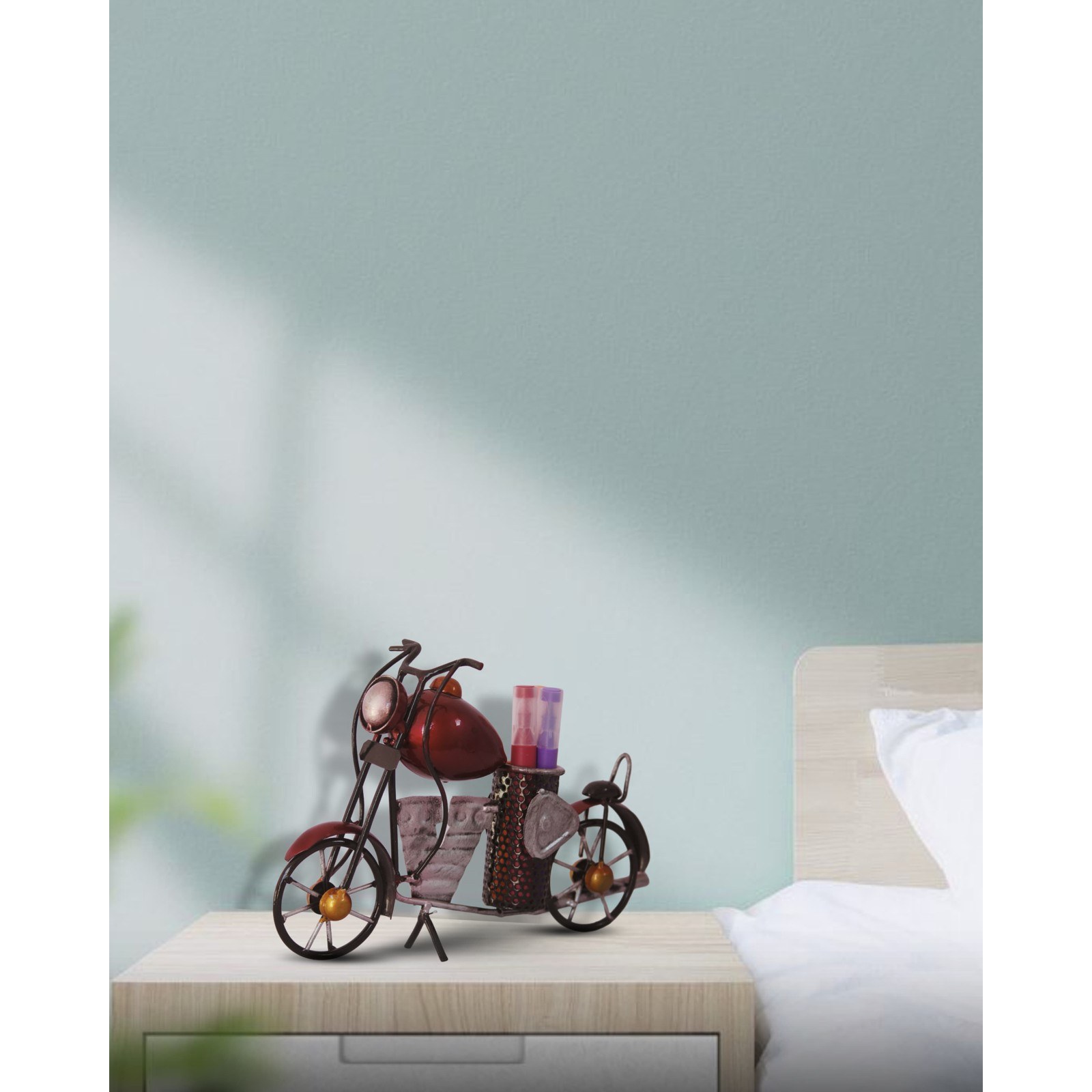 Bike pen stand holding pens on a bedside table