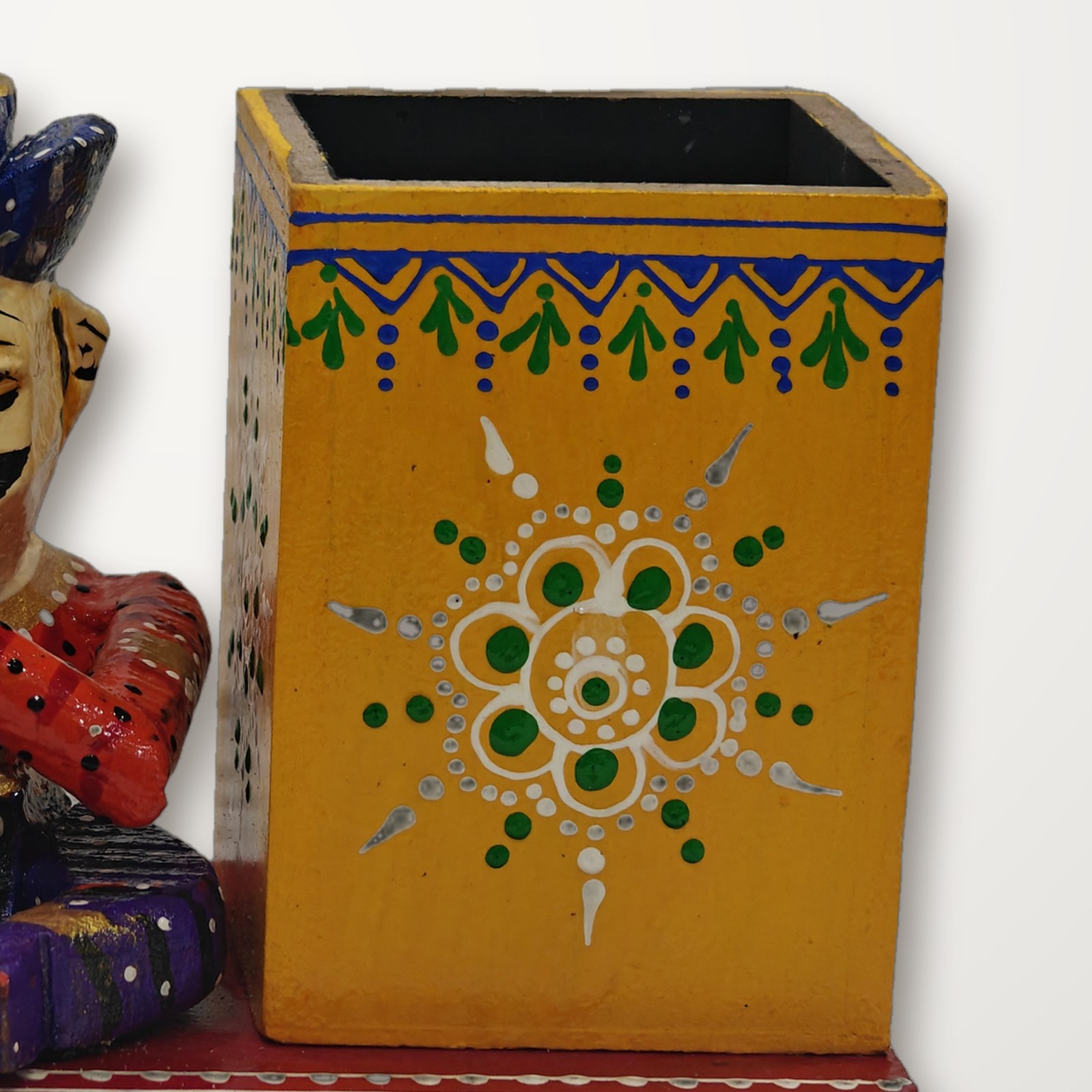 Close-up of the painted pen box with its floral motif