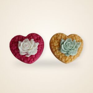 Blossom Heart Woven Candle, red and yellow pair, handmade soy wax, on a cream backdrop