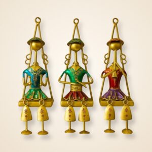Hanging Musician Dolls on a cream wall