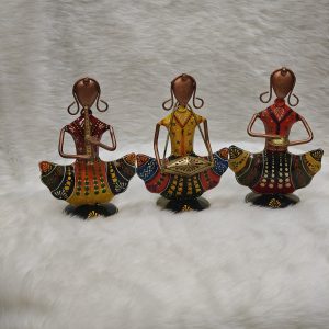Harmony Maidens, three red and yellow musician figurines on white fur