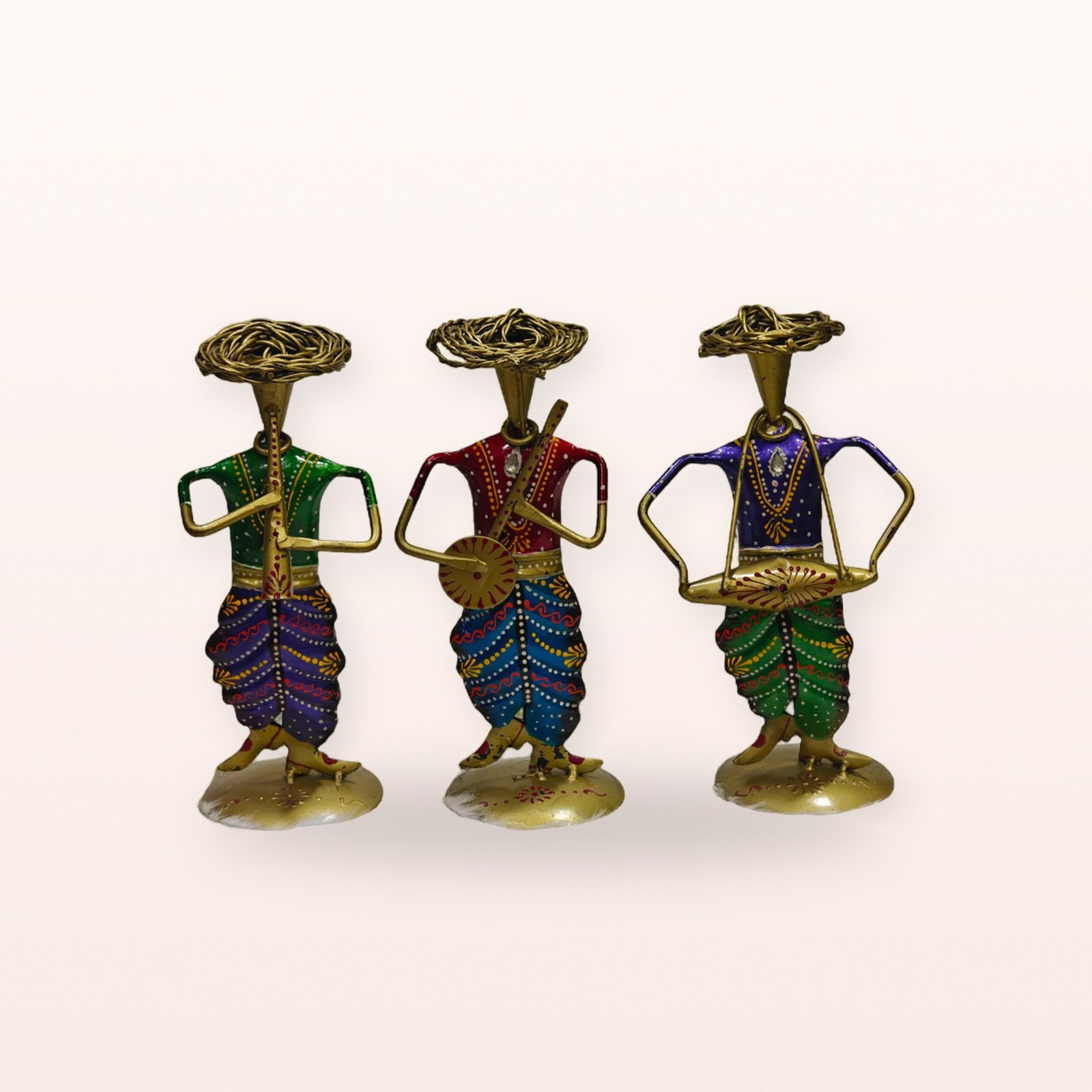 Tribal Artist Figurines, on a soft blush background