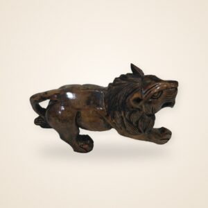 Polished Wooden Lion Figurine, on a cream background