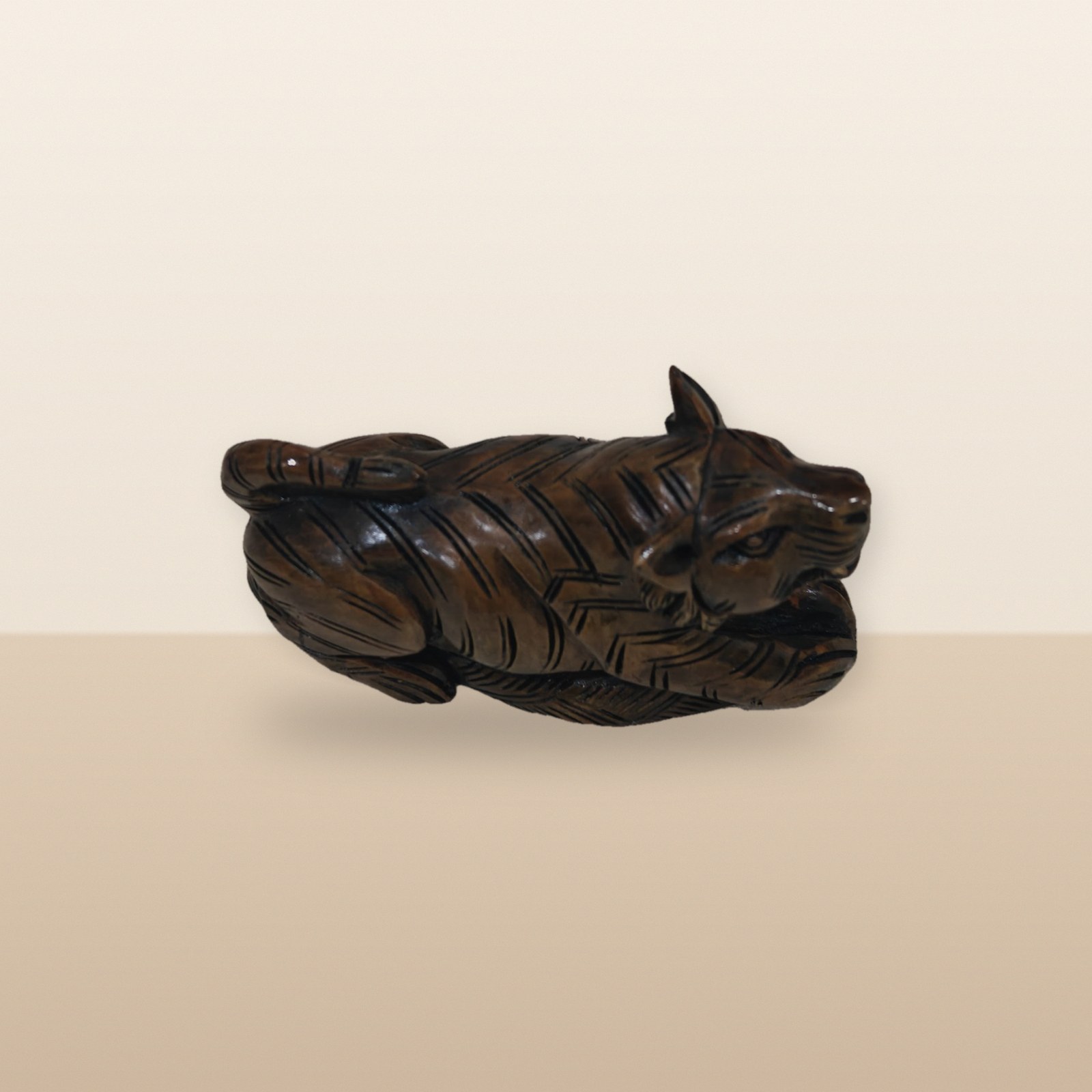Polished Wooden Lion Figurine, on a tabletop