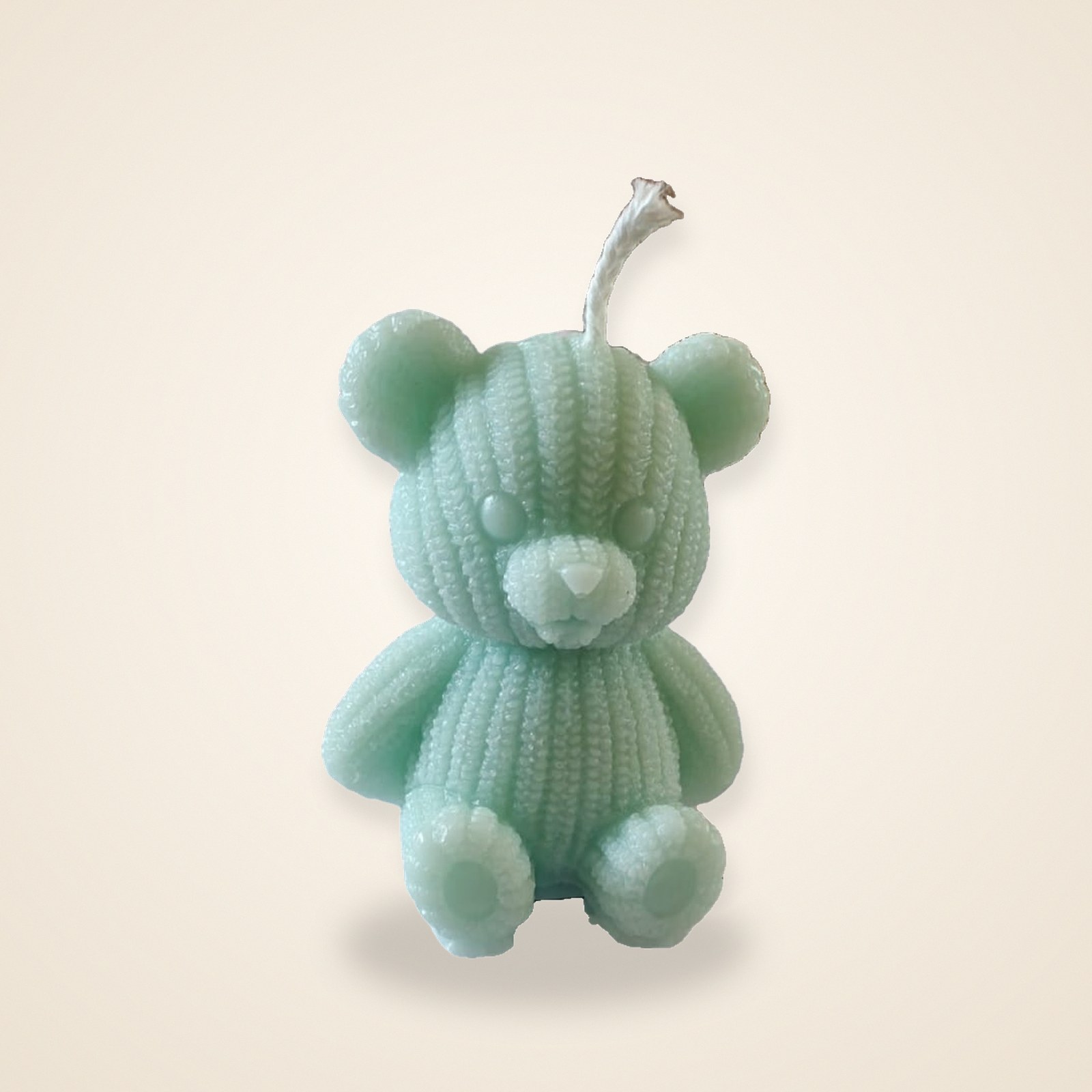 Mint Cuddle Bear Candle, on a cream background