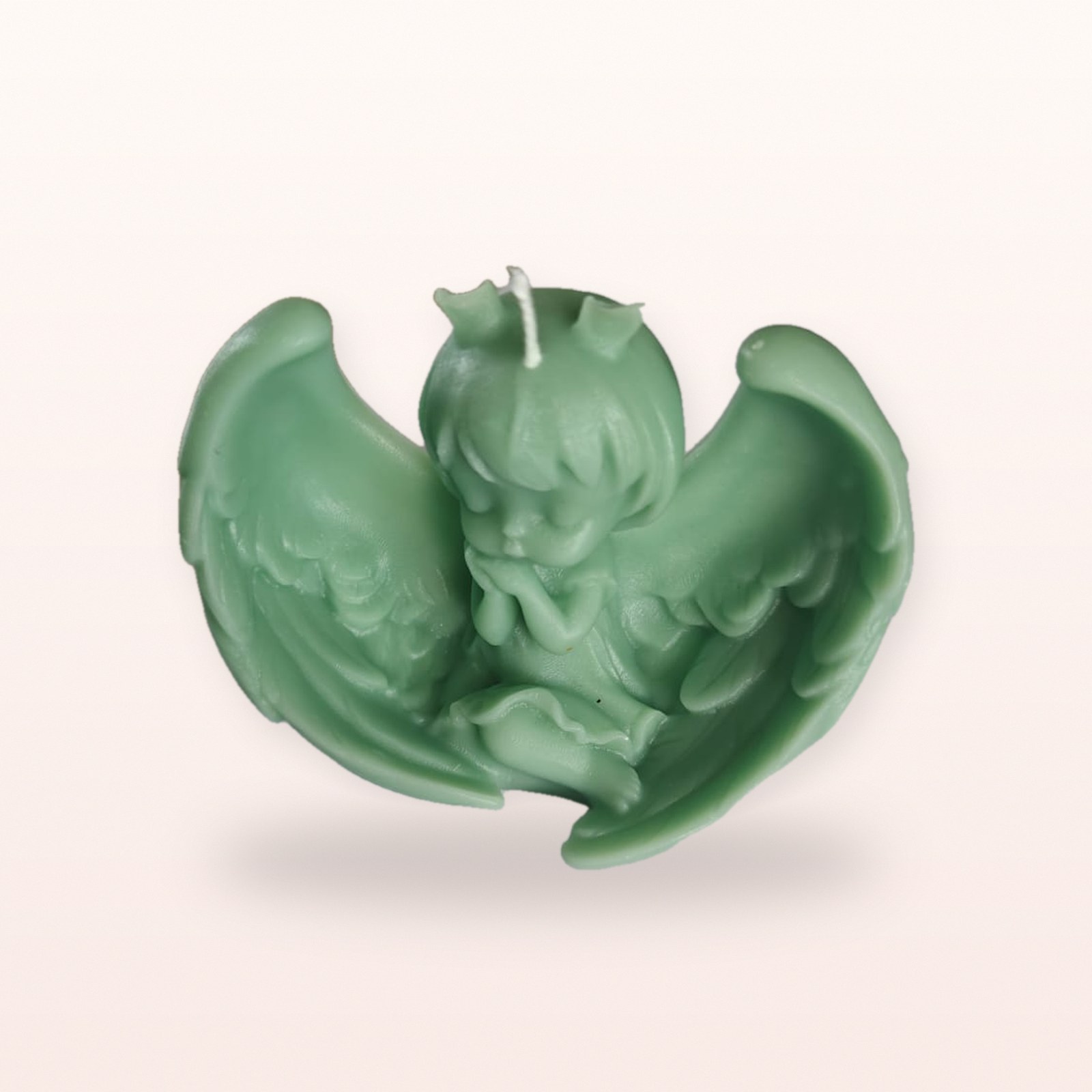 Angel with Wings Candle, on a soft blush background