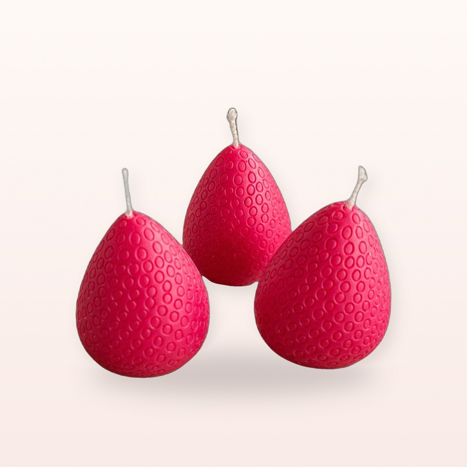 Strawberry Candle, on a soft blush background