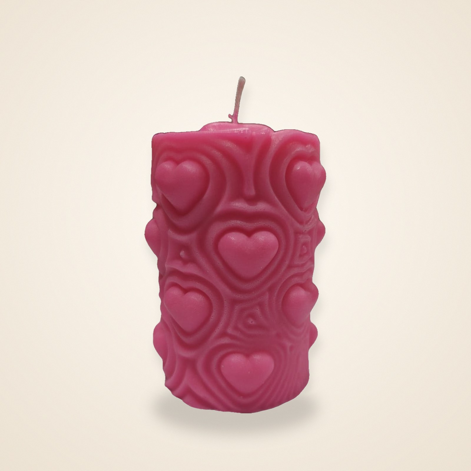 Blush Heartbeat Pillar Candle, on a cream background