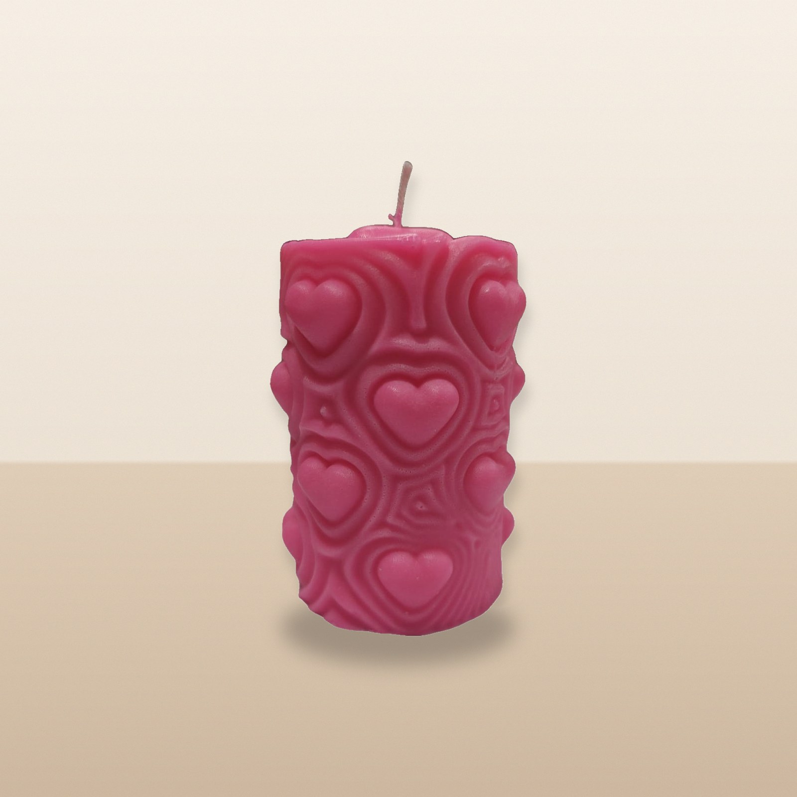 Blush Heartbeat Pillar Candle, on a tabletop