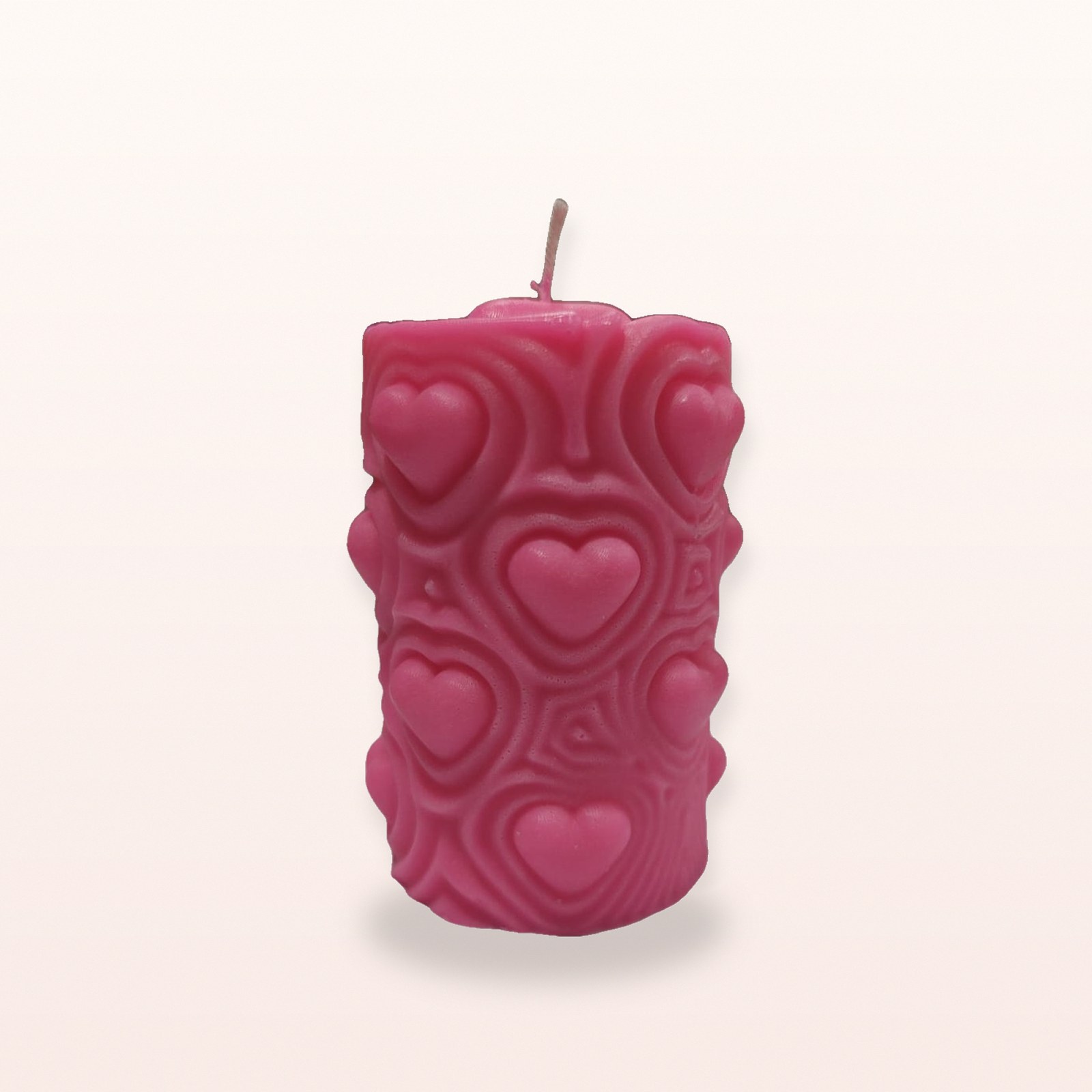 Blush Heartbeat Pillar Candle, on a soft blush background