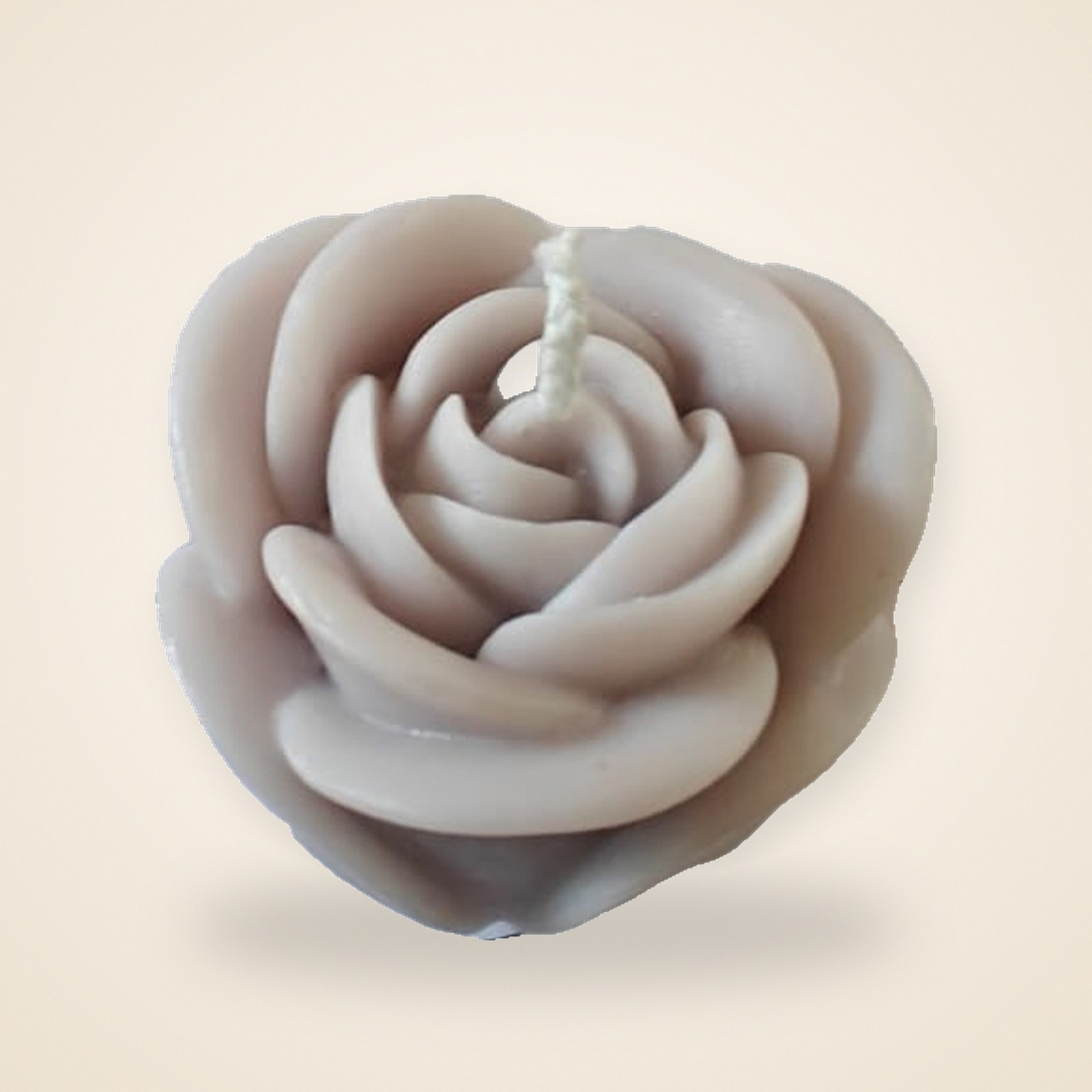 Rose Bloom Candle, on a cream background