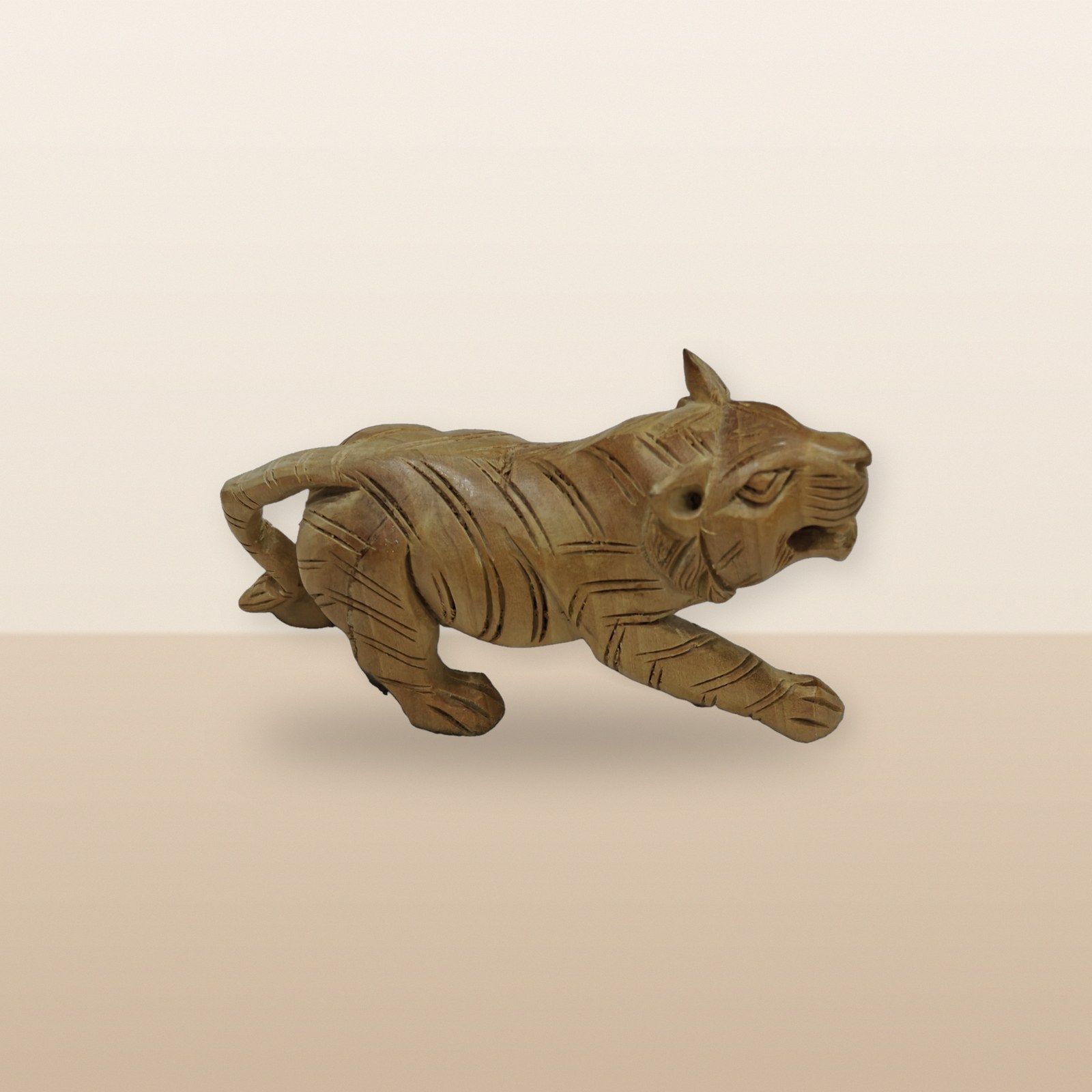 Wooden Tiger Figurine, on a tabletop
