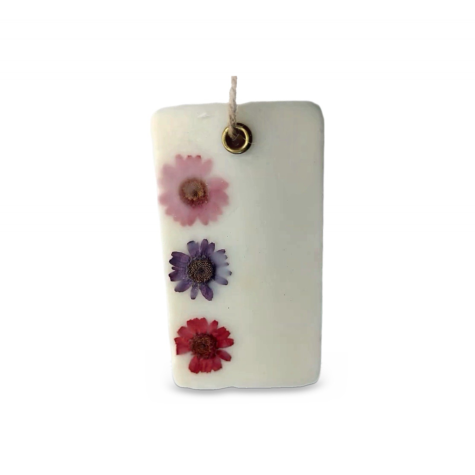 Botanical Wax Tag, white rectangle with three pressed flowers and a cotton cord, on white