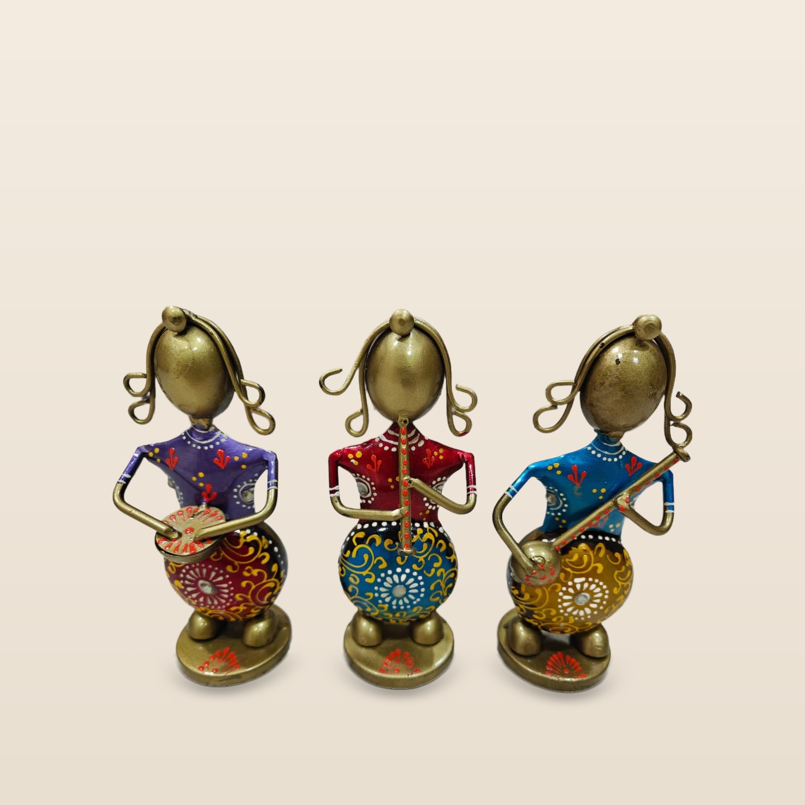 Raagini Trio lady musician figurines, set of 3, on a cream background