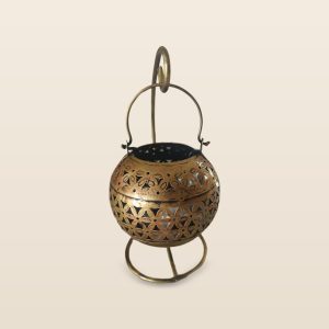 Lota jaali lantern with ring stand, on a cream background